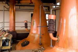 Image of whiskey stills which are part of a distillery automation project